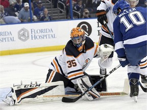 Edmonton Oilers goaltender Al Montoya (35) makes a save on a shot from Tampa Bay Lightning center J.T. Miller (10) during the second period of an NHL hockey game Sunday, March 18, 2018, in Tampa, Fla.