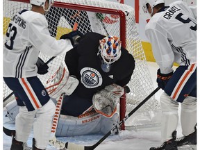 Goalie Mikko Koskinen (19) makes a stop during a training camp scrimmage at Rogers Place in Edmonton, September 14, 2018.