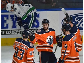 Edmonton Oilers Ty Rattie (8) celebrates his first of three goals n the night with teammates against the Vancouver Canucks during NHL pre-season action at Rogers Place in Edmonton, September 25, 2018.