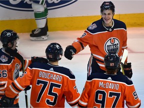 Edmonton Oilers Jesse Puljujarvi (98) celebrates his one of two goals with teammates against the Vancouver Canucks during NHL pre-season action at Rogers Place in Edmonton, September 25, 2018.