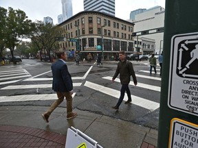 The city has launched a new pedestrian scramble pilot intersection on Jasper Avenue and 104 Street. A pedestrian scramble temporarily stops all vehicles, allowing pedestrians to cross the intersection in every direction, including diagonally, at the same time in Edmonton, September 21, 2018. Ed Kaiser/Postmedia
