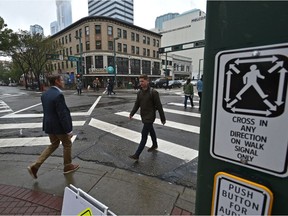 The city has launched a new pedestrian scramble pilot intersection on Jasper Avenue and 104 Street. A pedestrian scramble temporarily stops all vehicles, allowing pedestrians to cross the intersection in every direction, including diagonally, at the same time in Edmonton, September 21, 2018.