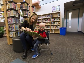 Teacher assistant Jennifer Kirsch works with  Grade 1 student Alex Whitford on Monday, Sept. 17, 2018 at LaPerle Elementary School in Edmonton. Alex has a a rare and fatal disease called progeria that causes his little body to age unusually fast.