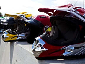 Helmets sit on a barricade at the Castrol Raceway in Nisku, Alberta.