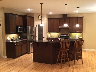 Before and after: Reface Magic extended these cabinets all the way to the ceiling, boosting storage space