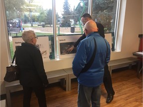 Lansdowne residents discuss the two staircase options with a city official at the public engagement session Tuesday evening.