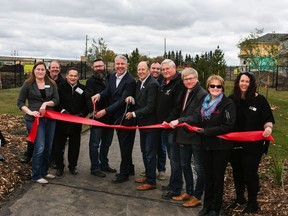 Builders and developers were all smiles at the Woodbend grand opening event in Leduc on Saturday, Sept. 29.