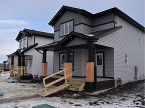 A line of new houses under construction in the fire-damaged Stoney Creek neighbourhood in Fort McMurray, Alta. on Sunday, Feb. 12, 2017.