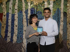 Winnie Yeung and Abu Bakr al Rabeeah pose for a photo at Highlands Junior High in May 2018. Together the two wrote the story of Abu Bakr al Rabeeah's life in Syria and how he and his family escaped civil war to Edmonton. Homes: A Refugee Story has just been nominated for a Governor-General's Award for non-fiction.