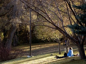 Visitors to Hawrelak Park sit and enjoy the warm weather, in Edmonton Wednesday Oct. 17, 2018.
