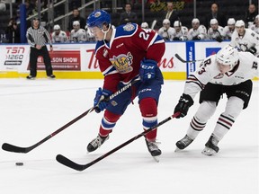 The Edmonton Oil Kings' Brett Kemp (24) battles the Red Deer Rebels' Oleg Zaytsev (13) during first period WHL action at Rogers Place, in Edmonton Friday Oct. 19, 2018.
