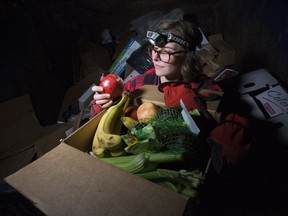 Anna Gnida with some of the food she collected while dumpster diving in Edmonton on Friday, Oct. 19, 2018. Gnida believes she and her household might be Edmonton's first waste-free collective.