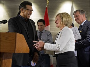 Alberta Premier Rachel Notley and Lubicon Lake Band Chief Billy Joe Laboucan take part in a press conference after the Band, Alberta, and the Federal Government reached a historic land claim settlement, in Edmonton Wednesday Oct. 24, 2018.