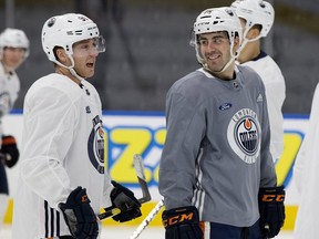 (left to right) Drake Caggiula and Evan Bouchard take part in an Edmonton Oilers practice at Rogers Place, in Edmonton Friday Oct. 26, 2018. Photo by David Bloom