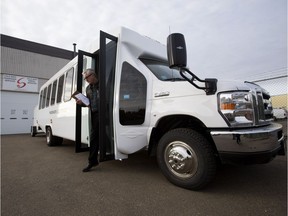 A member of the Cold Shot public relations team steps off one of the bus service's new buses in Edmonton on Wednesday, Oct. 31, 2018. Cold Shot is hoping its fleet of 18 buses will help fill the void left by Greyhound.