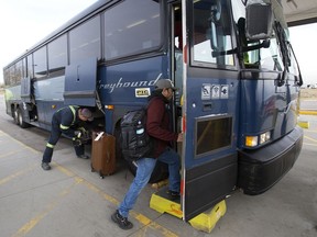 Customers board the last outgoing Greyhound bus at the Edmonton Greyhound station, Wednesday Oct. 31, 2018. Photo by David Bloom