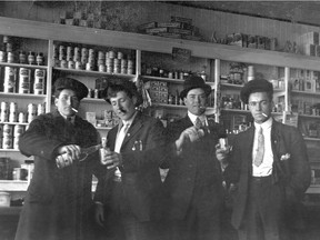Alexander Bourassa, Frederick Plamondon, Arthur Bourassa and Benoit Plamondon are seen drinking and smoking inside the Plamondon store circa 1920. During Prohibition in Alberta, general stores often sold illicit alcohol hidden in other containers. Another kind of prohibition ends Wednesday when recreational marijuana becomes legal in Canada.