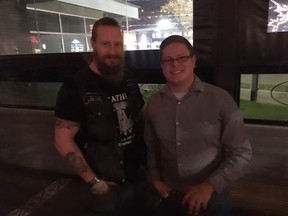 UCP nomination candidates running in Edmonton-West Henday faced criticism after the Soldiers of Odin Edmonton chapter posted pictures of candidates posing with group members at a UCP pub night on Friday, Oct. 5, 2018. Here, candidate Lance Coulter, right, poses with one of the group members at the pub night.