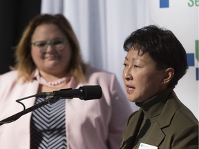 Dr. Verna Yiu, president and CEO, Alberta Health Services speaks while Sarah Hoffman, Minister of Health listens during an announcement that the Government of Alberta is investing $12 million to advance the development of a new neurosciences intensive care unit (neuro ICU) at the University of Alberta Hospital on Wednesday, Oct. 3, 2018 in Edmonton.  (Greg  Southam - Postmedia) For a Dustin Cook story running October 4, 2018.