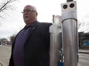 Don Belanger, the program manager for the Capital City Clean Up, shows the media new ashtray that have been installed. As cannabis legalization looms, city staff set up designated smoking areas along Edmonton's two most popular streets on Monday, Oct. 15, 2018 in Edmonton.