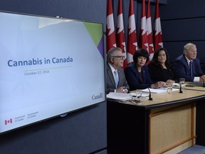 Ralph Goodale (left to right), Minister of Public Safety and Emergency Preparedness, Ginette Petitpas Taylor, Minister of Health, Jody Wilson-Raybould, Minister of Justice and Attorney General of Canada, and Bill Blair, Minister of Border Security and Organized Crime Reduction, attend a news conference on the Cannabis Act in Ottawa, Wednesday, Oct.17, 2018.