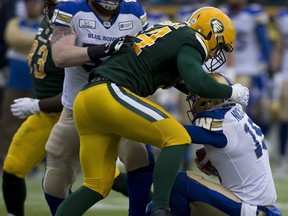 Edmonton Eskimos Jake Ceresna (94) sacks Winnipeg Blue Bombers quarterback Matt Nichols during first half CFL action on Saturday, Sept. 29, 2018 in Edmonton.