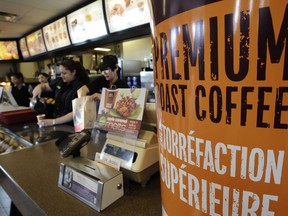 McDonald's staff at 51 Ave. and Calgary Trail filling coffee orders. File photo.