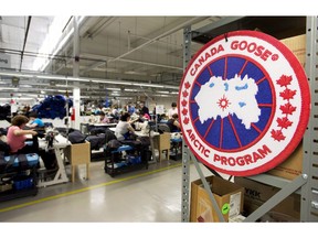Canada Goose's CEO Dani Reiss has spent considerable time and money trying to stop the flow of counterfeited goods, but Reiss has a complicated relationship with fake products because he admits they can have benefits. Employees work with Canada Goose jackets at the Canada Goose factory in Toronto on Thursday, April 2, 2015.