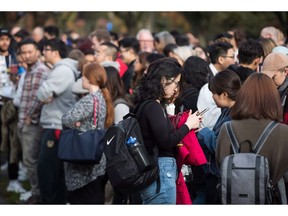 A Quebec school board has developed an algorithm that identifies students at risk of dropping out, and now the Education Department is looking to replicate it provincewide. Students are shown in Vancouver in a Friday, October 26, 2018 file photo.