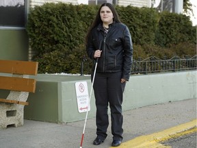 Meagan Houle, an intern in communications who takes DATS to work daily, in Edmonton on Sunday, Oct. 14, 2018. DATS clients request a pickup time, then must wait just inside the exterior door for the vehicle to arrive.