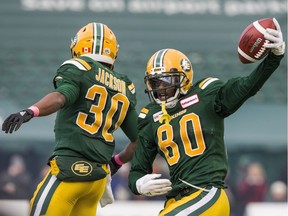 Edmonton Eskimos' Bryant Mitchell (80) and Martese Jackson (30) celebrate Mitchell's 75 yard touchdown during second half CFL action against the Ottawa Redblacks, in Edmonton on Saturday, Oct. 13, 2018.