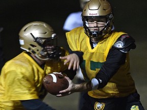 Edmonton Huskies quarterback Brendan Guy (17) hands off the ball during practice at Huskie House Kinsmen in Edmonton, October 24, 2018. Ed Kaiser/Postmedia