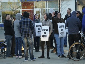 Canada Post workers picket outside the Canada Post downtown delivery depot on Monday October 22, 2018. The postal service has started rotating strikes across the country today. (Photo by Larry Wong/Postmedia)