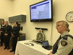 RCMP Cpl. Laurel Kading takes a question during a demonstration of the new Alberta RCMP crime map at St. Albert RCMP headquarters on Oct. 10, 2018. St. Albert launched the map —  which shows thefts from vehicles, break and enters, mischief, missing persons and thefts of vehicles — as a pilot project earlier this year. Now around 40 RCMP-policed jurisdictions in Alberta are using the map on their municipal websites.