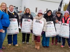 School support workers picket Monday Oct. 1, 2018, outside the Living Waters Catholic Schools division office in Whitecourt, Alberta. 120 AUPE members have been on strike since Sept. 28, 2018.