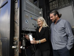 The Skysource/Skywater Alliance co-founders David Hertz, right, and his wife Laura Doss-Hertz demonstrate how the Skywater 300 works Wednesday, Oct. 24, 2018, in Los Angeles.