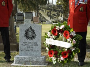 Joe Collinson of the RCMP Veterans Association pays his respects at a newly installed regimental headstone for Northwest Mounted Police Cpl. Maxwell George Bailey (Reg. No. 4968) at Edmonton Cemetery on Wednesday, Oct. 24, 2018.