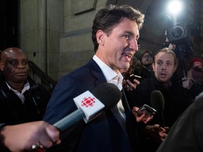 Prime Minister Justin Trudeau leaves the Office of the Prime Minister and Privy Council after an agreement was reached in the NAFTA negotiations in Ottawa on Sunday.
