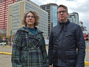 Downtown Edmonton Community League president Chris Buyze and Oliver Community League president Lisa Brown standing on one of the vacant lots along 100 Ave. near 104 St. and are questioning recent council decisions to allow construction of tall towers on small parcels of land in Edmonton, Oct. 6, 2018.