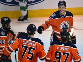 Peer pressure: Edmonton's last four first-round draft picks celebrate a preseason goal.