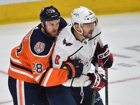 Edmonton Oilers Kyle Brodziak (28) contains Washington Capitals Alex Ovechkin (8) in front of Oilers net during NHL action at Rogers Place in Edmonton, October 25, 2018. Ed Kaiser/Postmedia