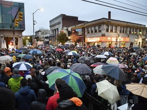 People gather for a vigil blocks from where an active shooter shot multiple people at Tree of Life Congregation synagogue on Saturday, Oct. 27, 2018, in the Squirrel Hill section of Pittsburgh.