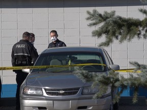 Edmonton police investigate an apparent shooting at the Royal Gardens Community Hall on Sunday, Oct. 21, 2018.