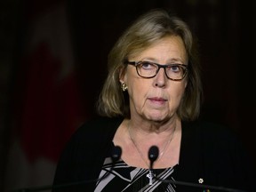 Green Party Leader Elizabeth May speaks to reporters on Parliament Hill on Monday, Oct. 15, 2018.