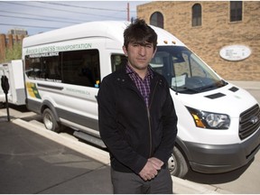 Rider Express Transportation owner Firat Uray stands by a van in his fleet on 11th Avenue in Regina. TROY FLEECE / Regina Leader-Post