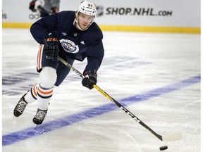 Edmonton Oilers' Connor McDavid controls the puck during a practice in Gothenburg, Sweden, Friday Oct. 5, 2018.