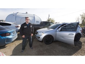 Det. Mark Kassian with the EPS Auto Theft with several of the recovered from a VIN cloning operation. Taken on Thursday, Oct. 4, 2018 in Edmonton.  (Greg  Southam - Postmedia) For Juris Graney story