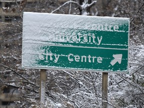 The city got blanketed with snow Sunday night in Edmonton, partially obscuring this sign on Monday October 8, 2018. Ed Kaiser/Postmedia
