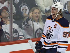 Edmonton Oilers centre Connor McDavid celebrates his third-period goal against the Winnipeg Jets in Winnipeg on Tues., Oct. 16, 2018.