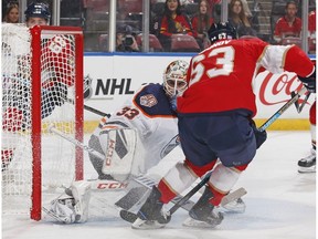 Goaltender Cam Talbot #33 of the Edmonton Oilers stops a shot by Evgenii Dadonov #63 of the Florida Panthers at the BB&T Center on November 8, 2018 in Sunrise, Florida.